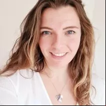 Katie Moffat smiling with white top